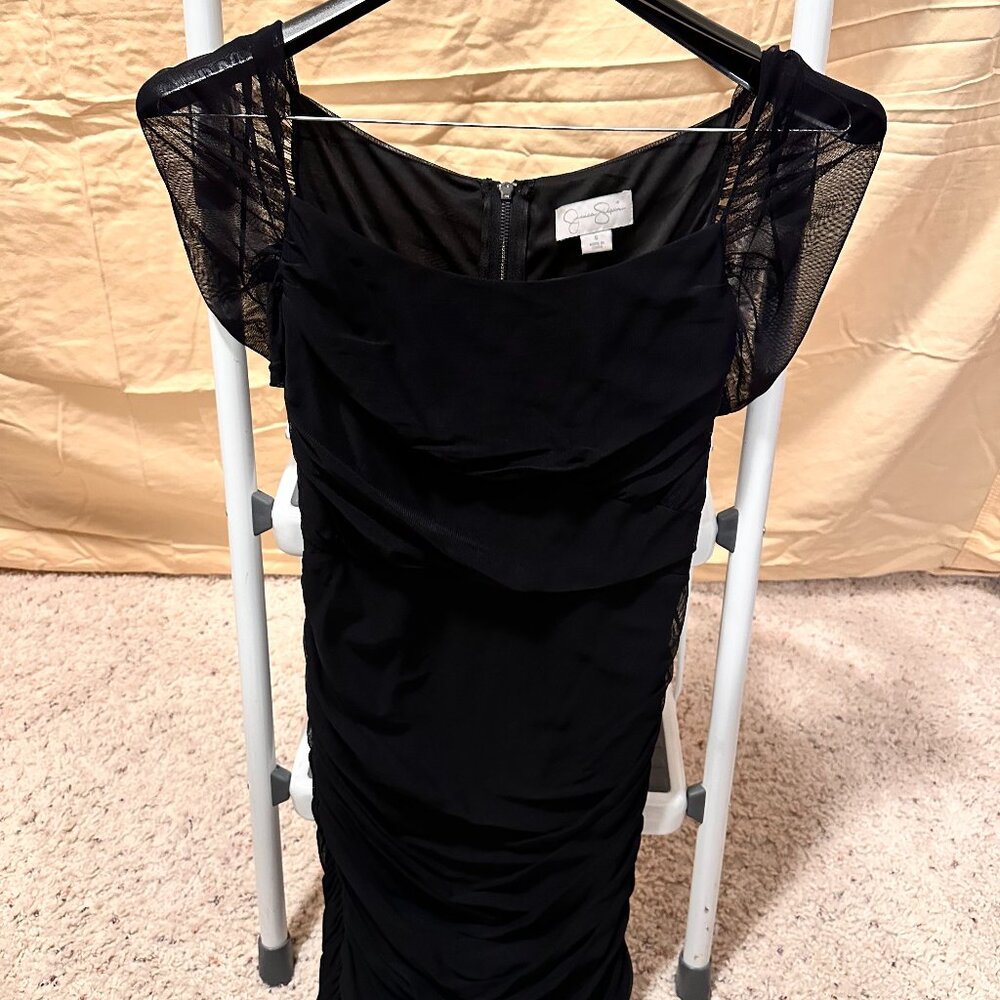 Black mini dress made of sheer voile fabric, short sleeves, full zipper back